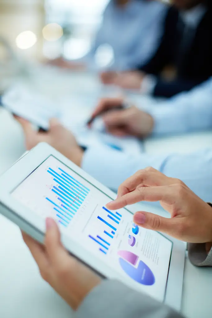 hands checking statistics on tablets
